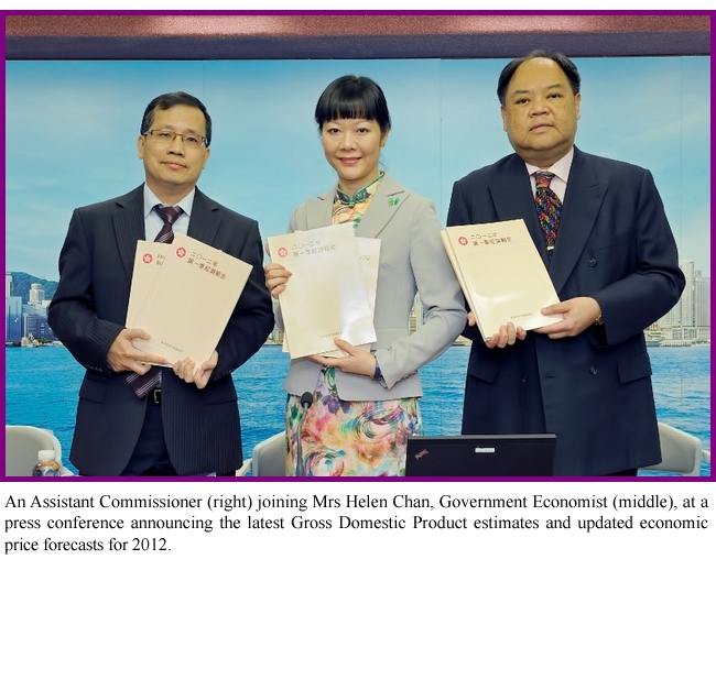 An Assistant Commissioner (right) joining Mrs Helen Chan, Government Economist (middle), at a press conference announcing the latest Gross Domestic Product estimates and updated economic price forecasts for 2012.