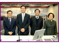 Deputy Commissioner (left), with Mr Frederick Ma, Secretary for Financial Services and the Treasury (second from left), at a media briefing on economic statistics in 2003.