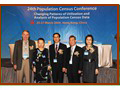 Mr H W Fung, Commissioner (second from right), Dr. Robert Retherford, Coordinator, Population and Health, East-West Center (first from left), Miss Au King-chi, Permanent Secretary for Financial Services and the Treasury (Financial Services) (second from left) and Mr Feng Nai-lin, Director-General, Department of Population and Employment Statistics, National Bureau of Statistics of China (centre), as officiating guests at the “24th Population Census Conference” in March 2009.