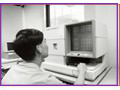 Reading trade statistics on microfiche using COM-reader in the 1990s.
