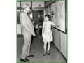 Explaining the Department's work to Sir Hugh Norman-Walker (left), Colonial Secretary, during his visit to C&SD in 1970.