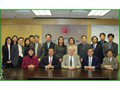 Mr Frederick W H Ho, Commissioner (second from left, front row), with Dr. David F Findley, Principal Researcher of Statistical Research Division of U.S. Census Bureau (centre, front row), during his visit to the Department in January 2004.