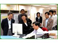 Miss Denise Yue (second from left), Secretary for the Civil Service, visiting the Department in August 2006.